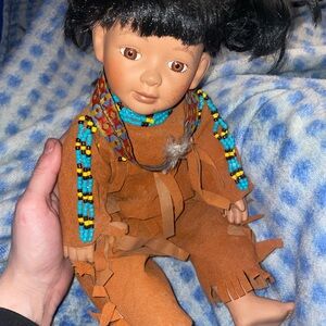 Brown Doll with Beaded Necklace and Traditional Outfit